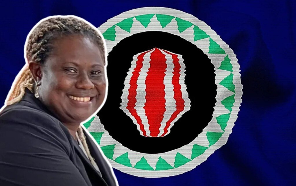 Headshot of woman with Bougainville flag behind her. 