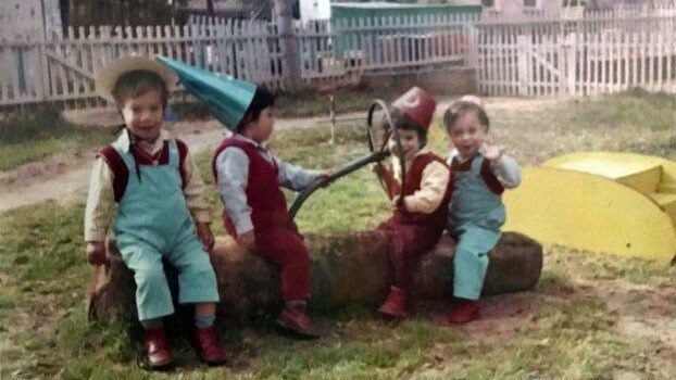 Children play dress up in a kibbutz playground in the 1970s.