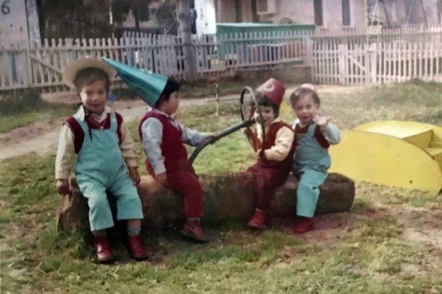 Children play dress up in a kibbutz playground in the 1970s.