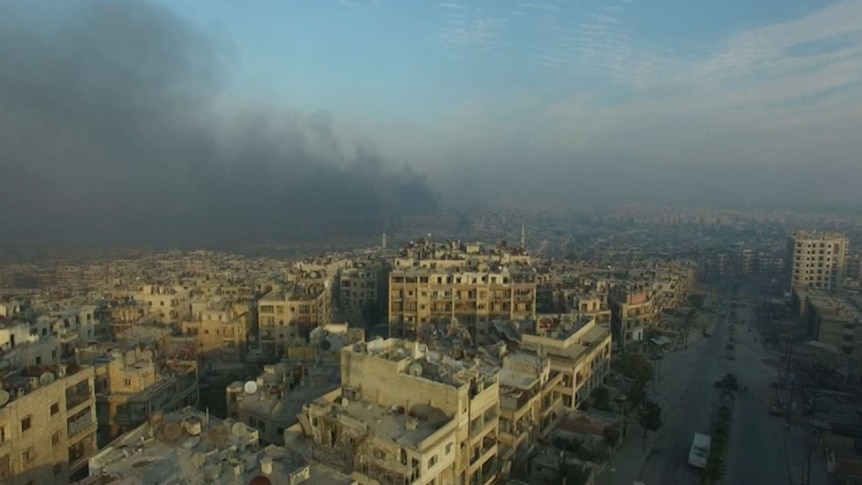 A general view of smoke rising over bomb damaged eastern Aleppo, Syria taken on December 12, 2016
