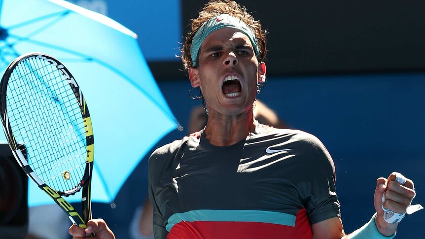 Rafael Nadal celebrates a point against Dimitrov