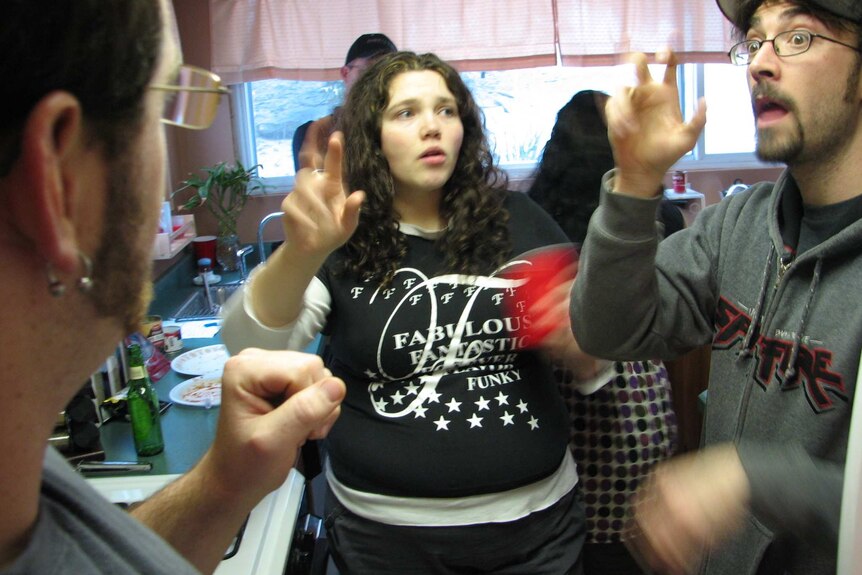 A family arguing in a kitchen