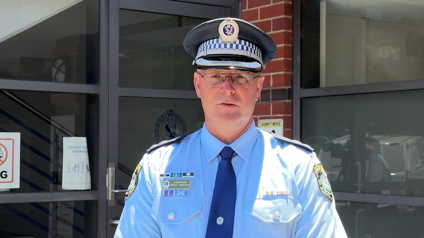 a policeman talking to the press