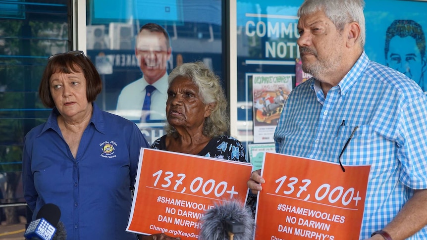 Olga Havnen, Helen Fejo-Frith and John Paterson stand outside Michael Gunner's office.