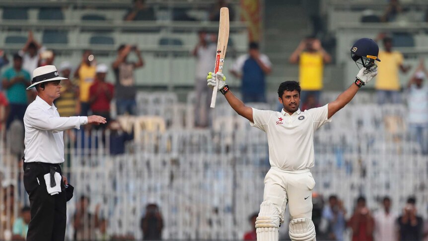 Heroic innings ... Karun Nair raises his bat after scoring a triple century against England in Chennai