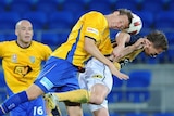 Goose eggs: Michael Thwaite heads the ball over Daniel McBreen during the scoreless draw.