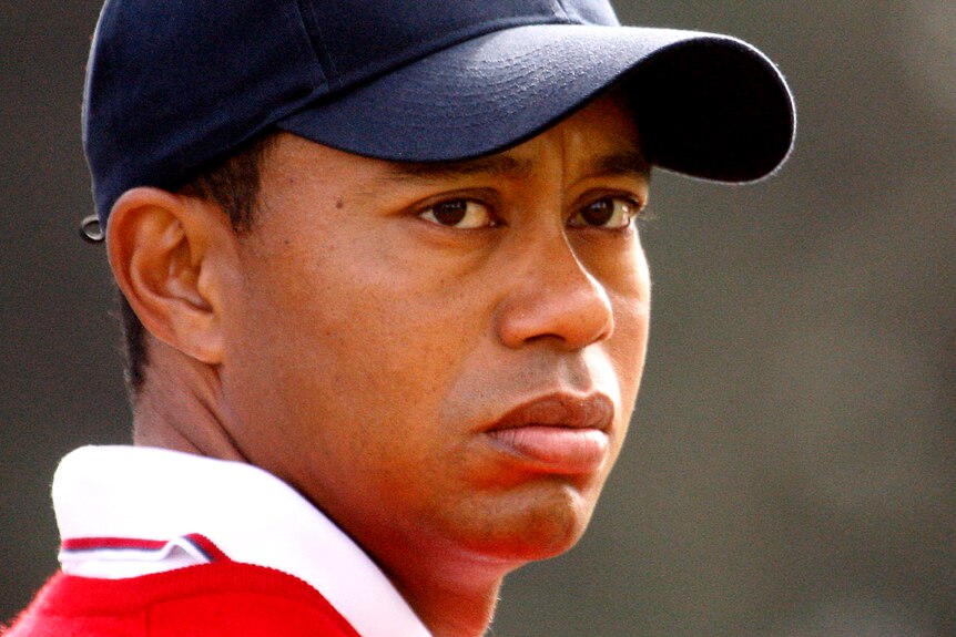 Tiger Woods in 2009 wearing a cap and with a serious expression on his face