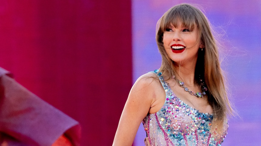 Taylor Swift close up on stage, smiling