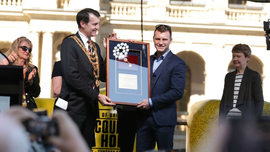 Brisbane Lord Mayor Graham Quirk hands the keys of the city to Jeff Horn