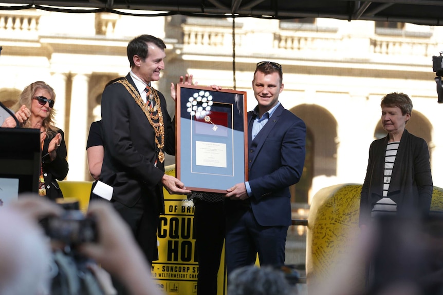 Brisbane Lord Mayor Graham Quirk hands the keys of the city to Jeff Horn