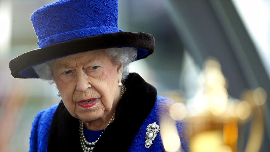 Queen Elizabeth in a blue hat.