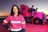 Woman standing in front of a truck