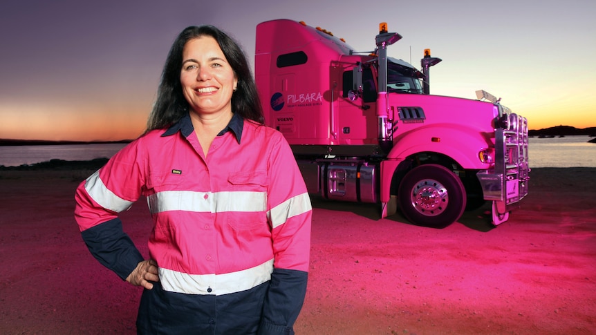 Woman standing in front of a truck
