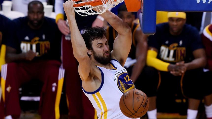 Slam dunk ... Andrew Bogut posts a basket for the Warriors in their win over the Caveliers