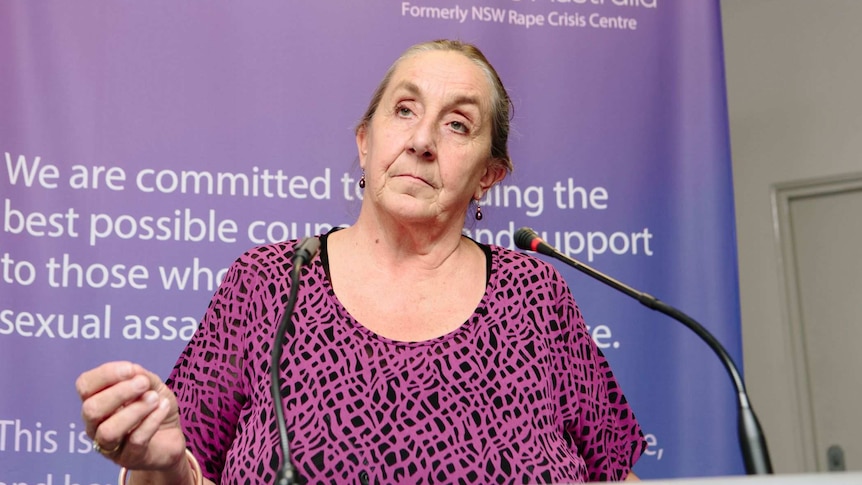 a profile photo of executive director of rape and domestic violence services australia karen willis with a serious expression