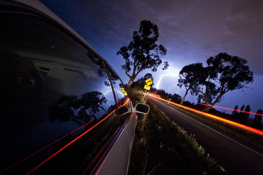 Lightning storm reflected in car window, Orange NSW