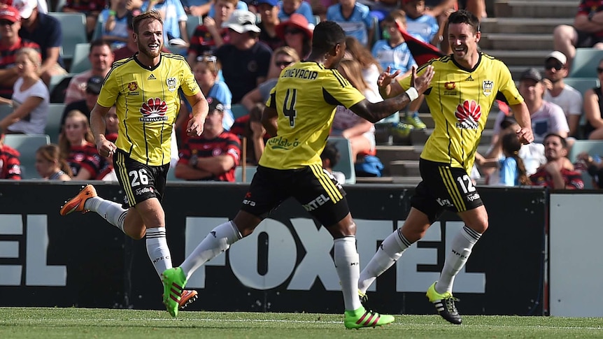 Wellington's Blake Powell (R) celebrates his goal against Western Sydney Wanderers with team-mates.