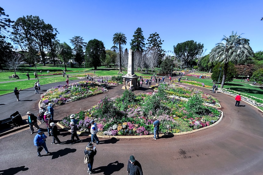 a wide shot of a flower display in a botanic garden