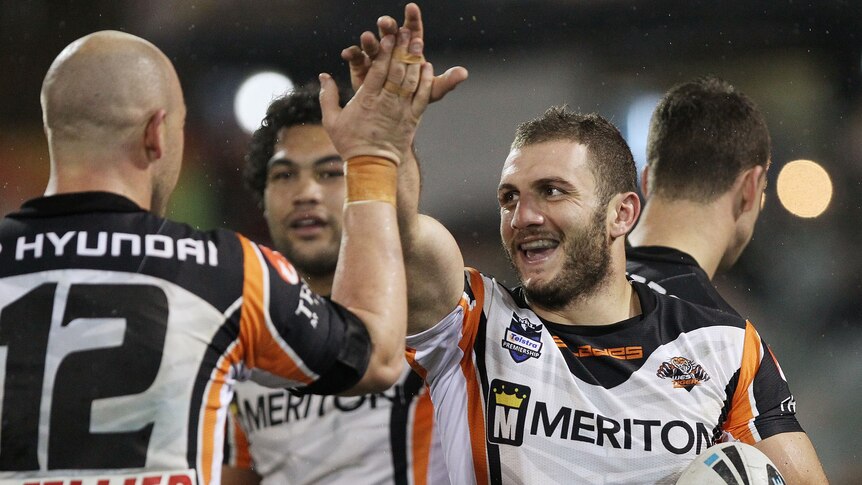 Showing their stripes ... Robbie Farah scored one of the Tigers' seven tries.