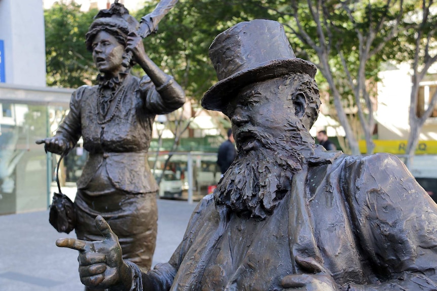 Statues of suffragette Emma Miller and former Premier Charles Lilley.