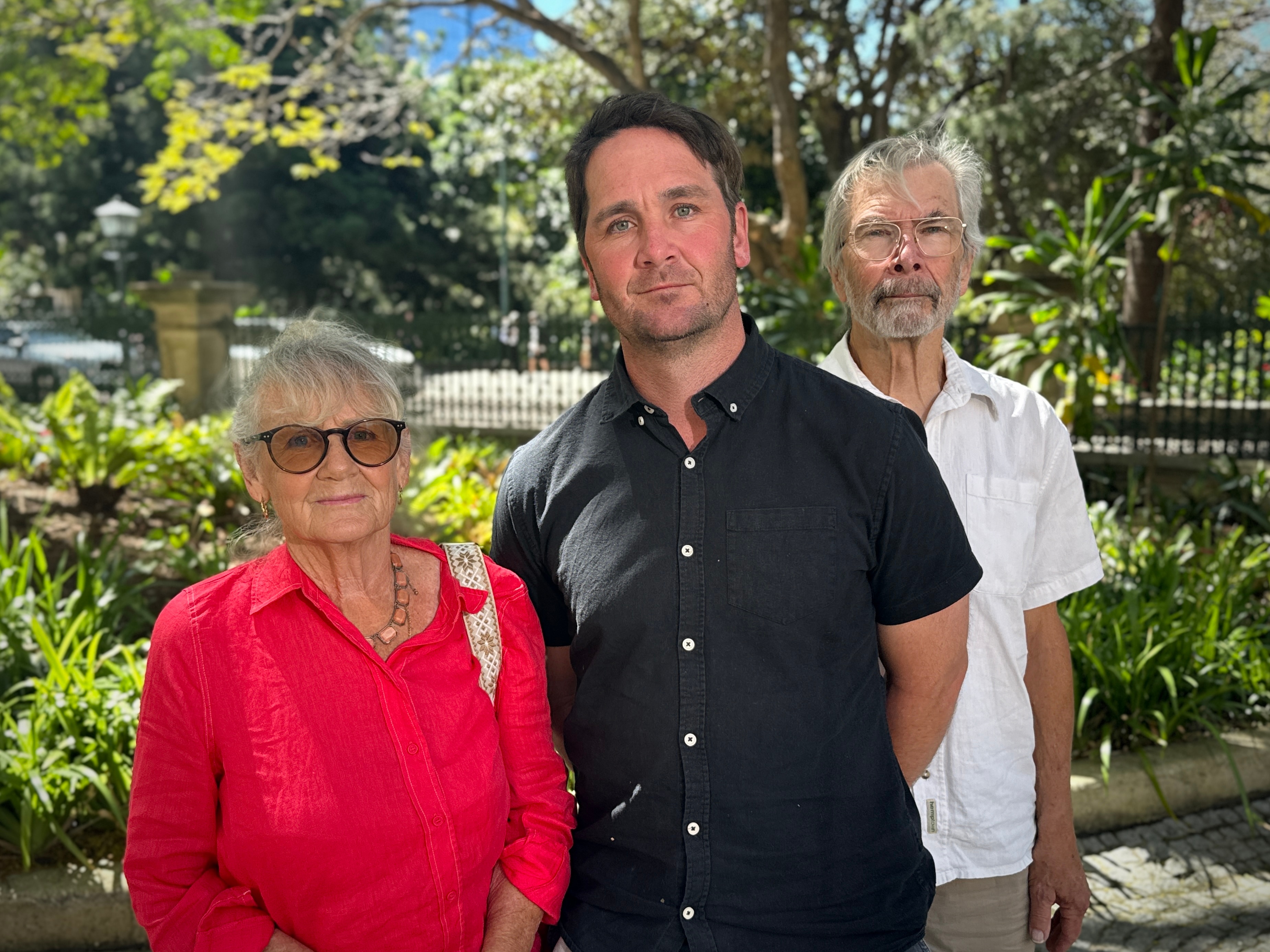 An older couple with their adult son