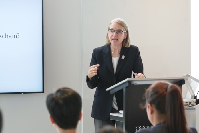 Dr Phillipa Ryan lecturing at a university.