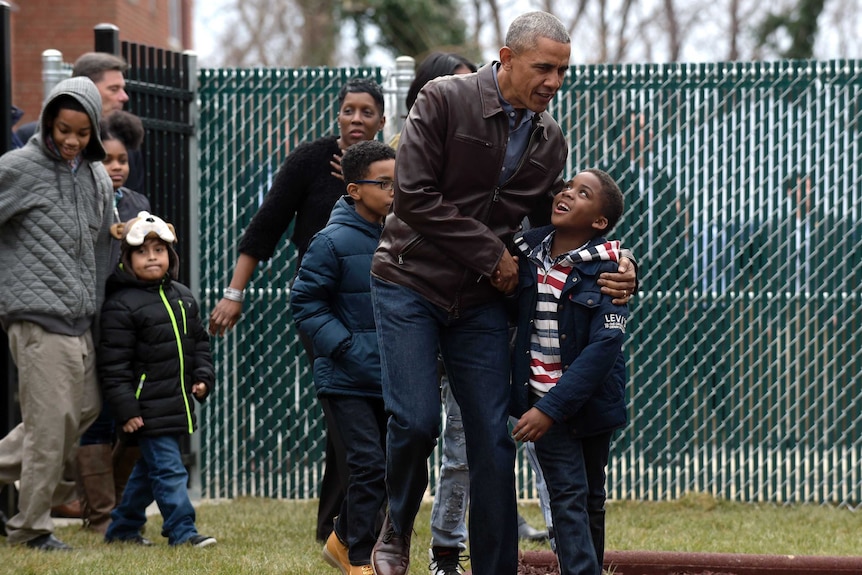 Barack Obama talks with kids