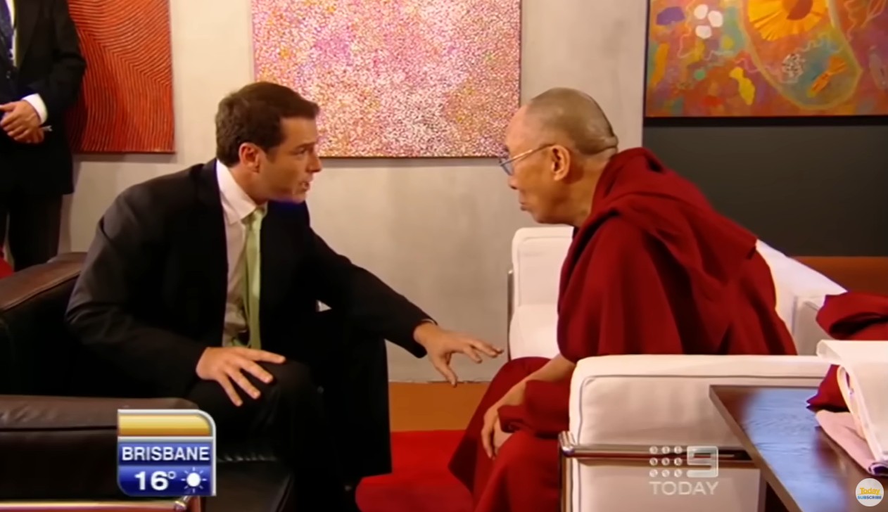 Karl Stefanovic leaning over speaking to the Dalai Lama