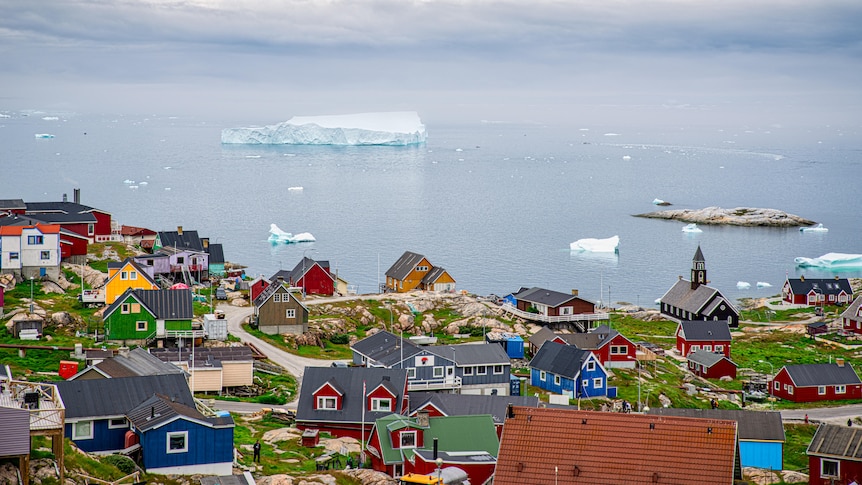 Aerial view of Ilulissat with icebergs floating in the background
