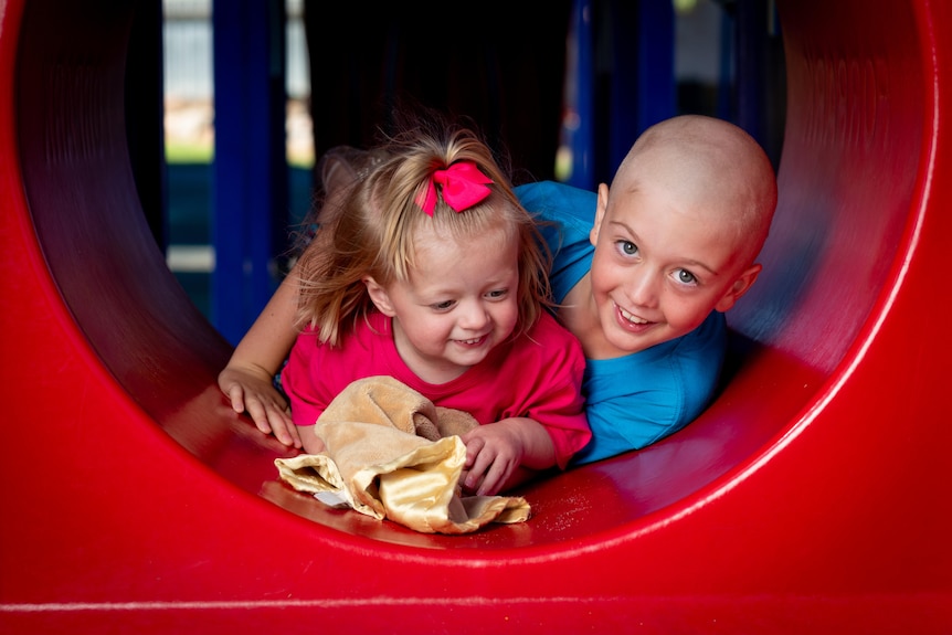 Edward and Evelyn Tuckerman smile in a playground.