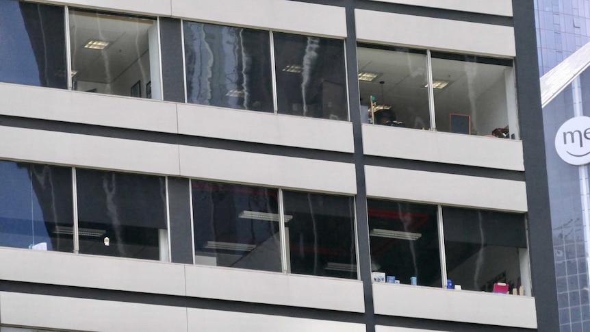 Windows in a high-rise office block in Melbourne's CBD.