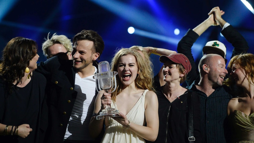 Emmelie de Forest holds the Eurovision trophy