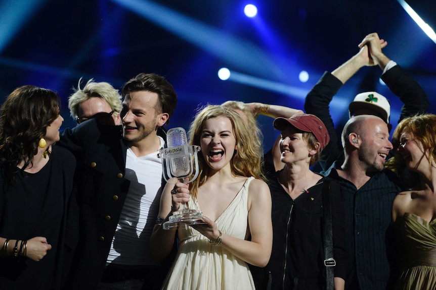 Emmelie de Forest holds the Eurovision trophy