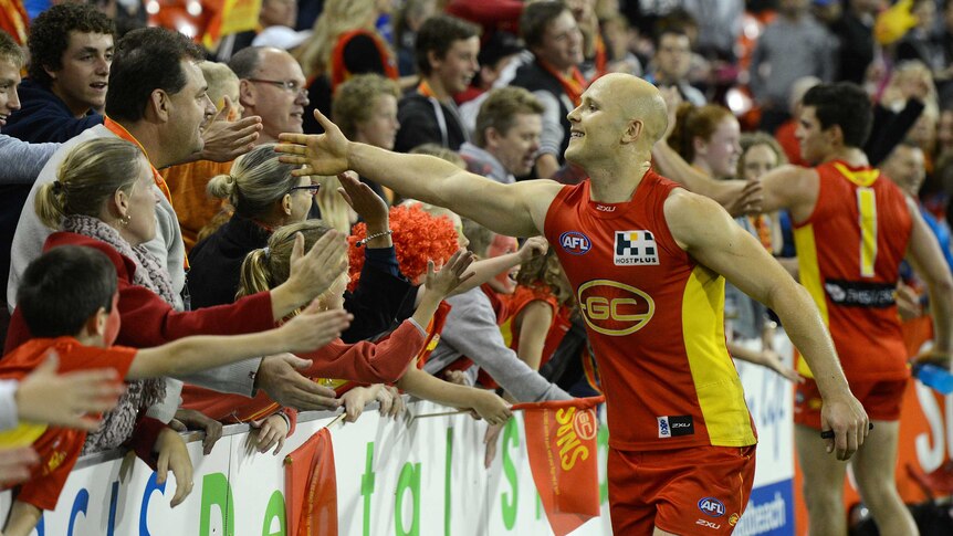 Suns captain Gary Ablett interacts with fans following the Round 17, 2013 win over Collingwood.