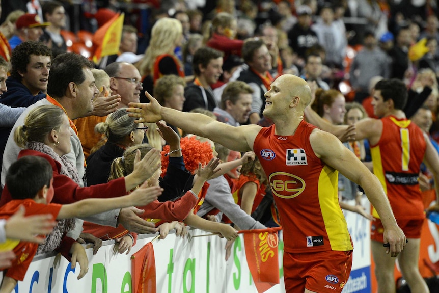 Suns captain Gary Ablett interacts with fans following the Round 17, 2013 win over Collingwood.