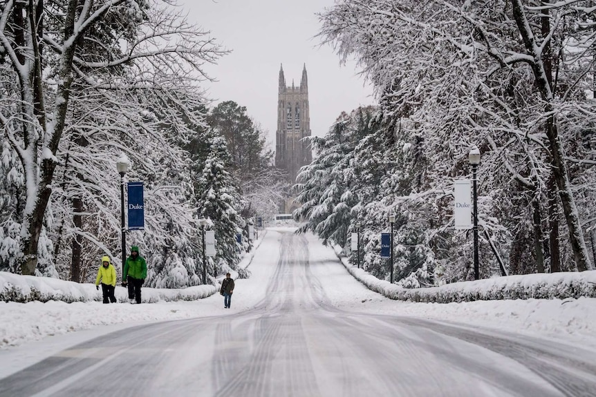 A snow-covered road leading to Duke Chapel at Duke University.