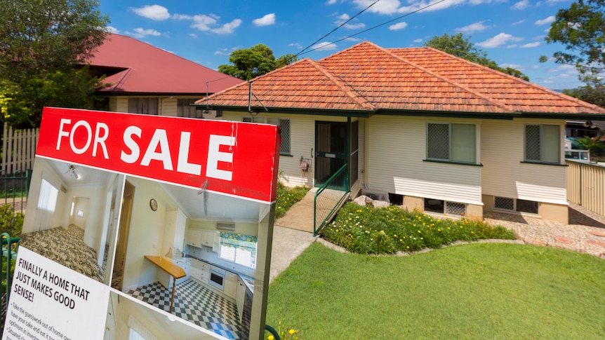 For sale sign in front of property with orange roof