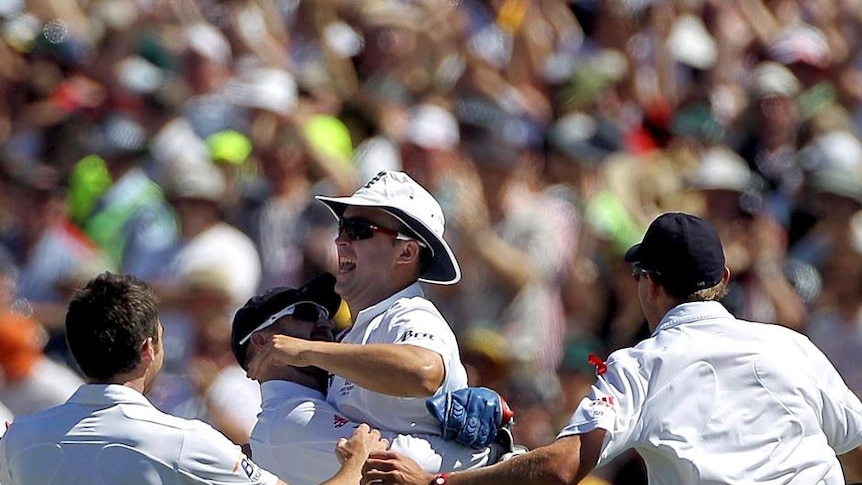 Early celebrations: Jonathan Trott runs out Simon Katich on the fourth ball of the morning.