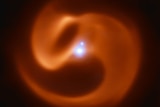 Infrared image of Apep — a swirling orange shape with bright points near its centre