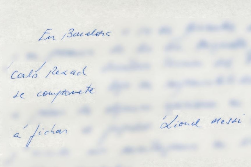 A napkin with Lionel Messi's name written in blue ink