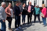 A group of people outside the ACT courts