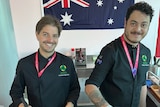 Two chefs cook food at the 2022 FIFA men's World Cup.