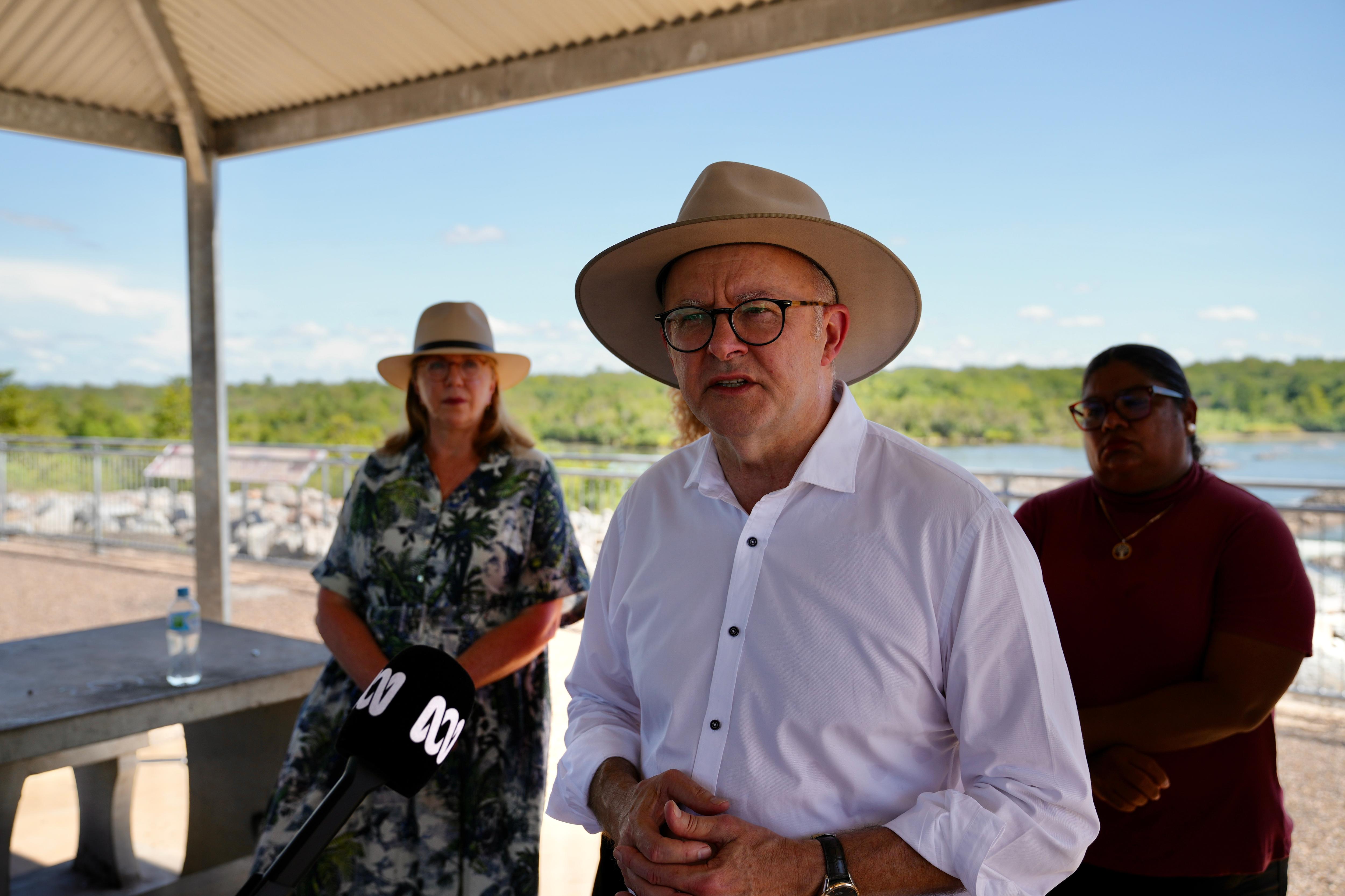 Wearing a white shirt and broad brimmed hat, Anthony Albanese speaks at a press conference in Kununurra