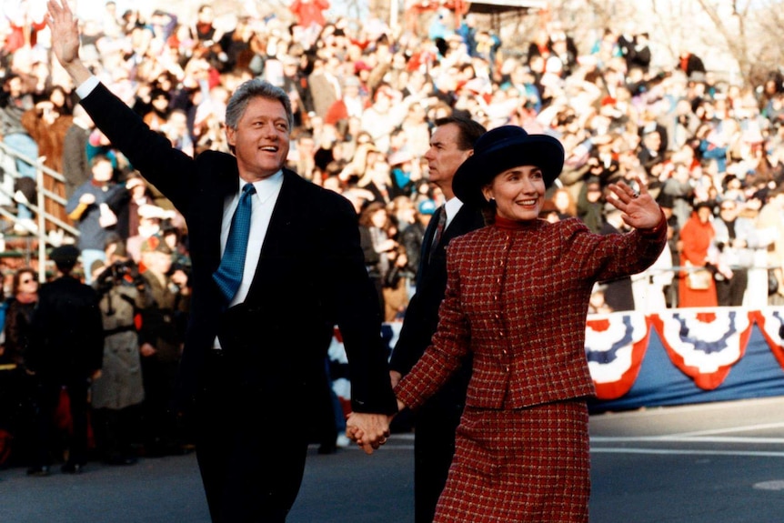 Bill and Hillary Clinton wave to supporters
