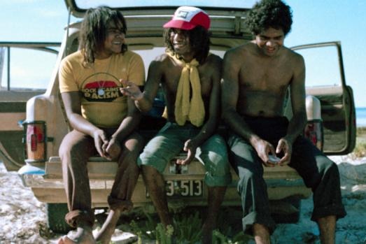 No Fixed Address members John Miller, Bart Willoughby and Chris Jones sit in the back of a car.