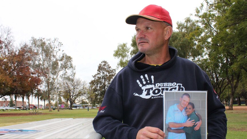 Dubbo resident Troy Parmount holds picture of deceased girlfriend Darlene Smith