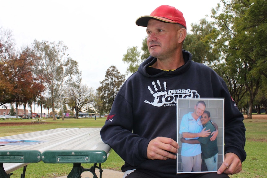 Dubbo resident Troy Parmount holds picture of deceased girlfriend Darlene Smith