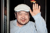 In this file photo, Kim Jong-nam waves after speaking to South Korean media.