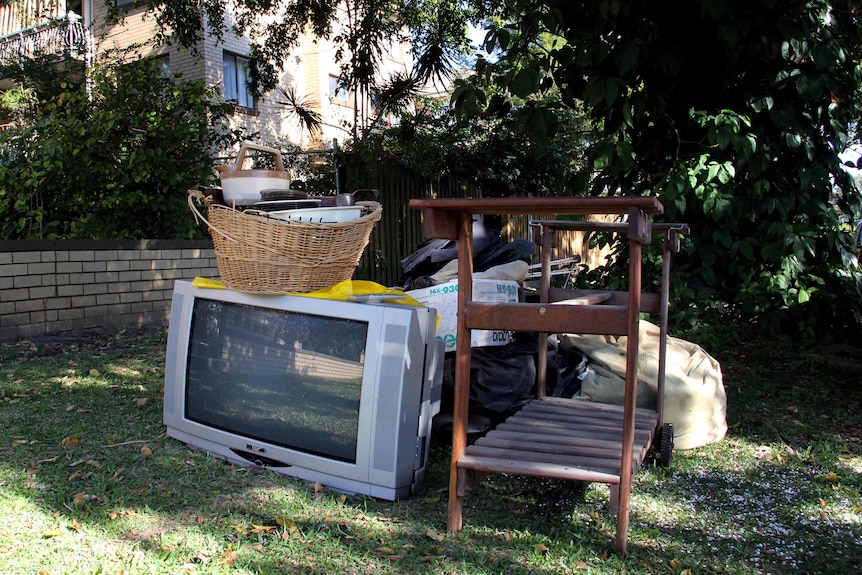 Household goods are left roadside for a council kerbside collection.