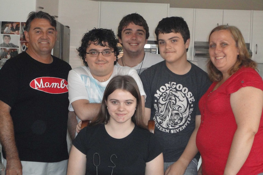 Courtney Topic with her father Ron (l), mother Leesa (r) and three brothers
